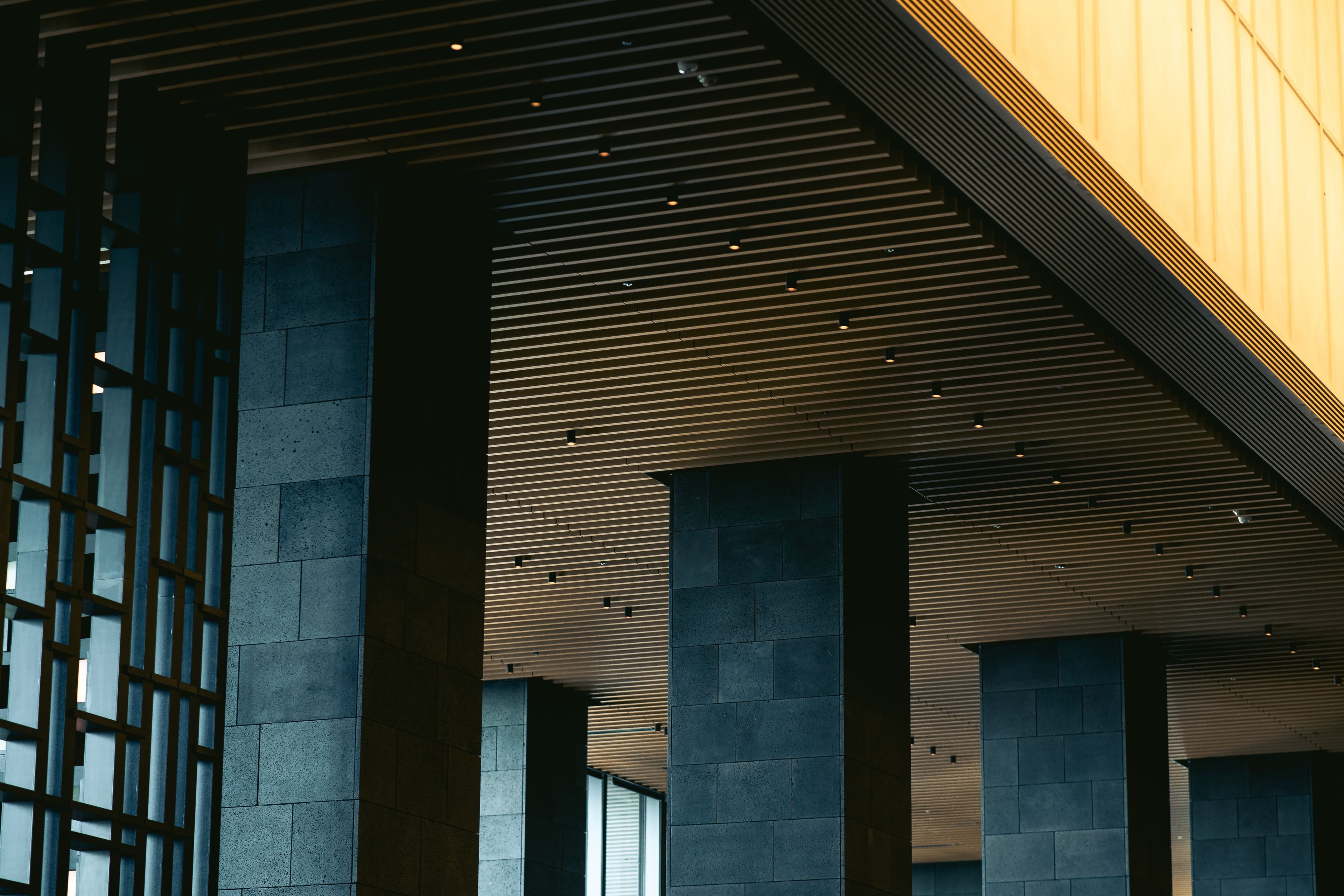 KESERA Cinematic Interior - Premium living room design with warm natural wood, elegant custom furniture, and soft daylight